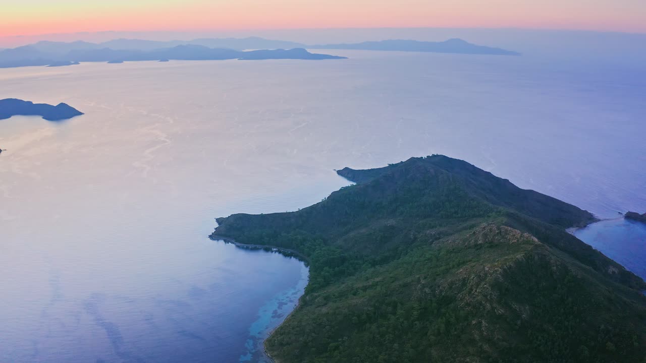 Flying above islands and peninsulas of Aegean Turkey at morning dawn