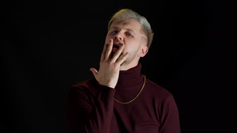 man in stylish blouse looking at camera through the hand, posing, feeling happiness, fun, enjoyment