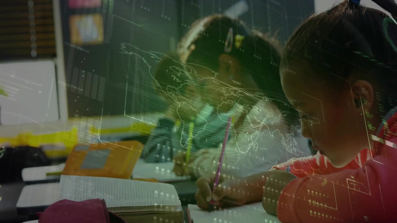 Camera panning right three students sitting writing in notebook to complete work under map overlay