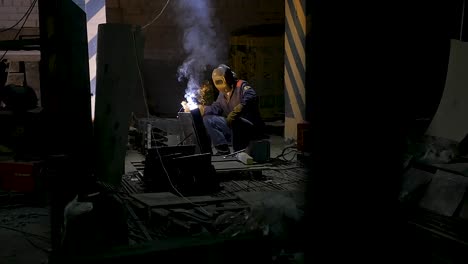 welder at work in industrial setting