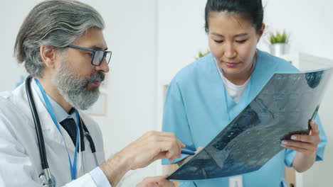 doctor and nurse reviewing x-ray