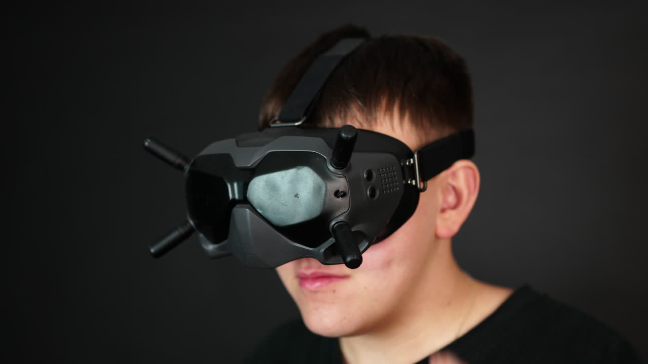 Man With VR Goggles Touching Commands on Headset, Close Up