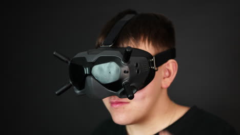 Man-With-VR-Goggles-Touching-Commands-on-Headset,-Close-Up