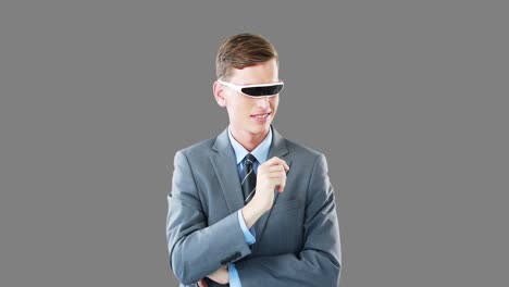 businessman in virtual video glasses using digital screen
