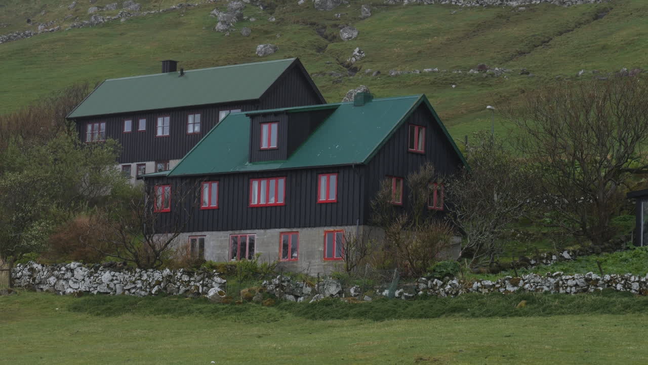 Traditional black houses with green roofs in the Faroe Islands