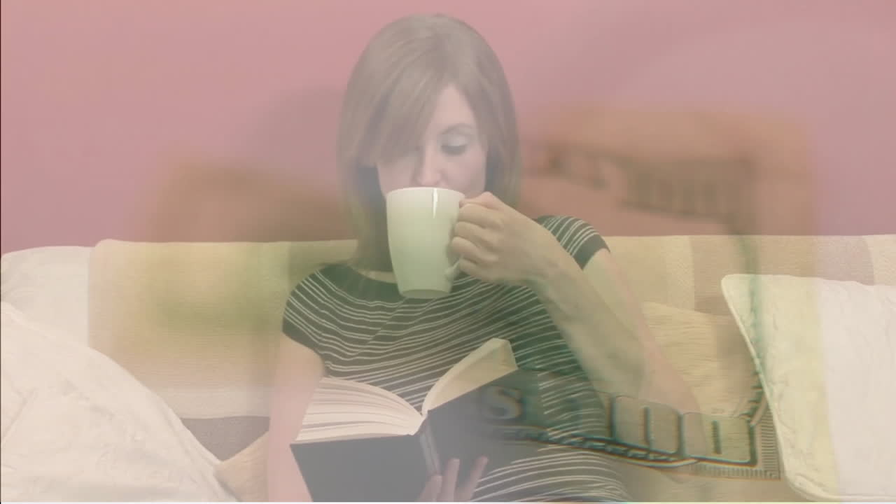 Animation of dollar banknote over caucasian woman reading book