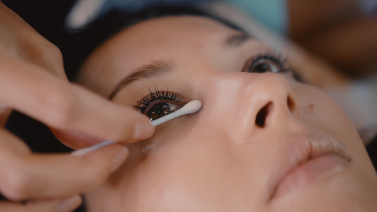 Woman getting eye treatment at a beauty salon