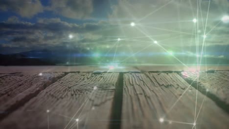 Animation-Eines-Leuchtenden-Netzwerks-Von-Verbindungen-über-Der-Nahaufnahme-Eines-Holzbretts-Vor-Wolken-Am-Himmel