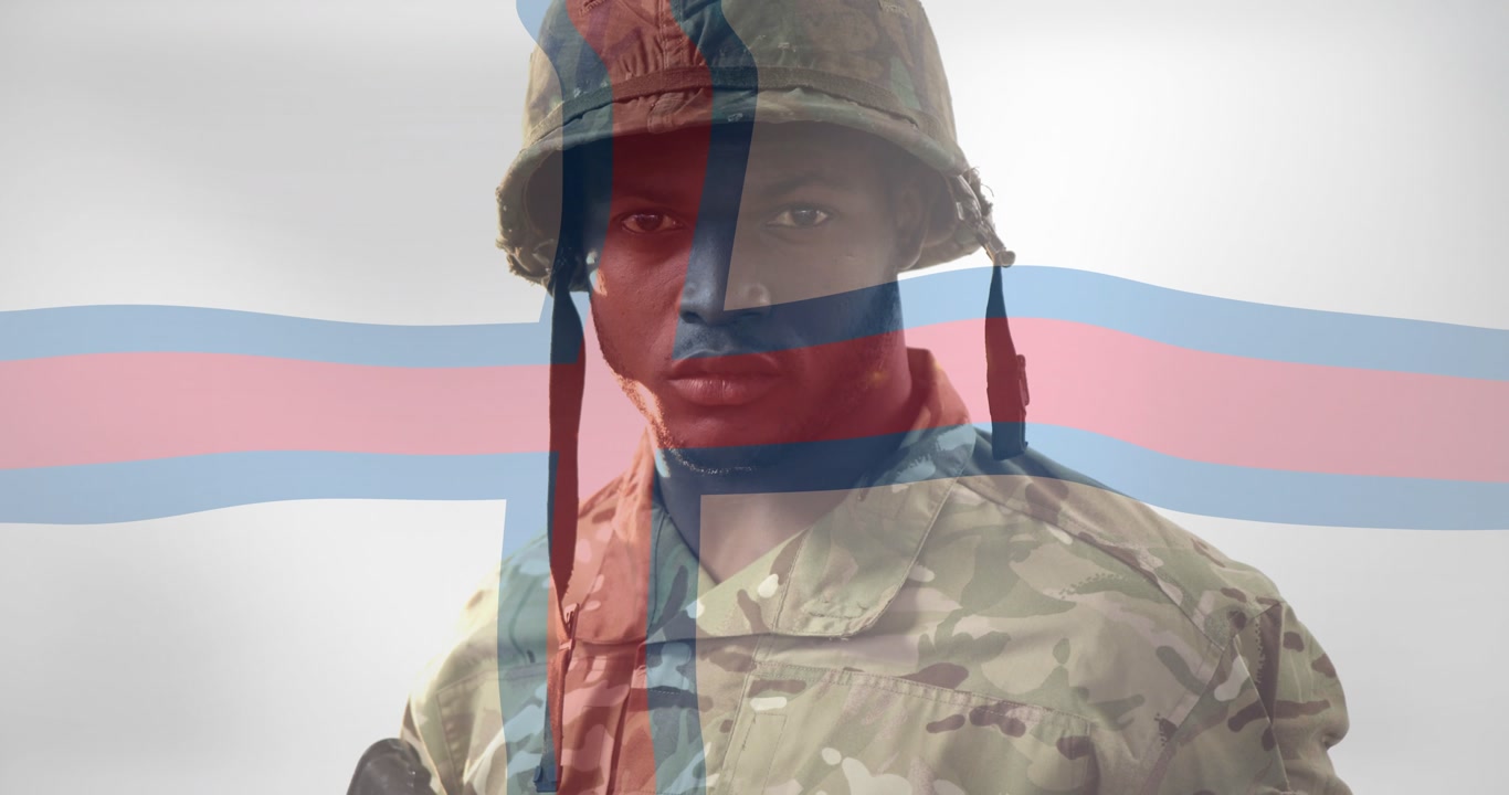 Soldier adjusting rifle grip in military studio, camera rising and flag overlay framing portrait
