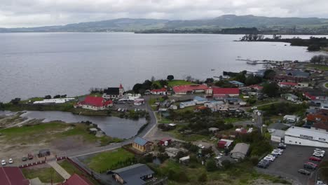 beautiful aerial panoramic shot of ohinemutu, living maori village and original settlement in rotorua, new zealand