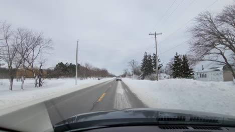 view from inside car of winter snowstorm in fort erie, ontario, canada