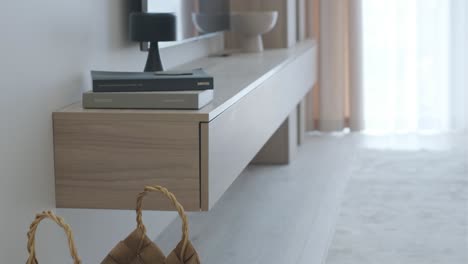 modern living room with wall-mounted tv stand and basket
