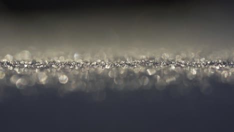 Macro-Shot-Of-Frozen-Snow-And-Ice-Crystals-Reflecting-In-Sunlight-During-Winter