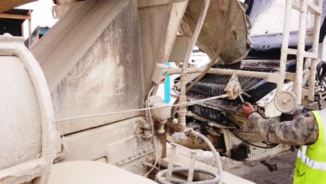 concrete mixer truck pours concrete