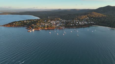 wide panoramic aerial view over coles bay and the blue waters of the ocean in australia