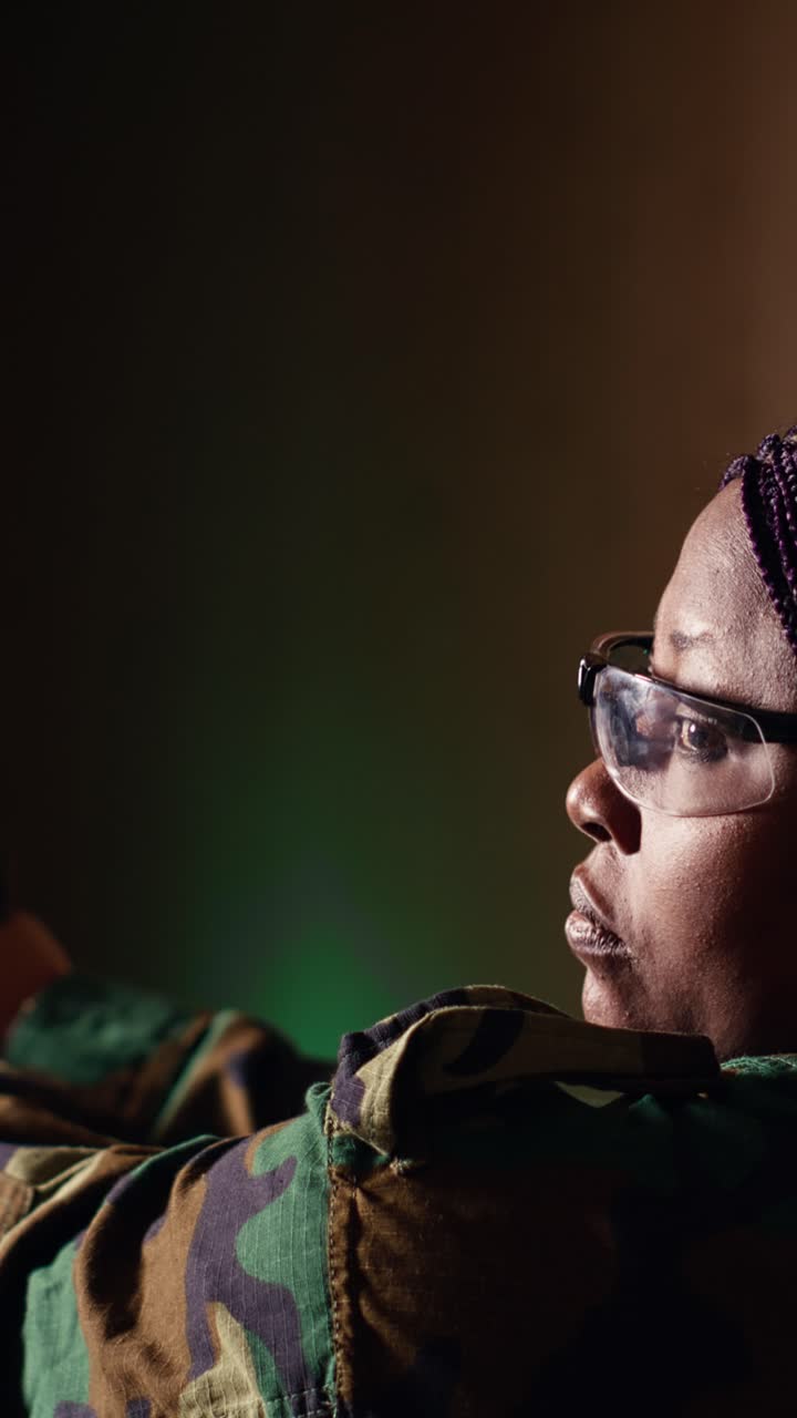 Vertical video Portrait of happy soldier holding rifle, developing marksmanship skills