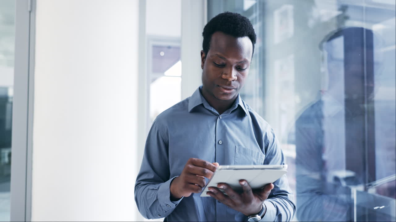 Black man, tablet and thinking