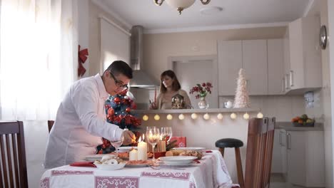 lesbian couple preparing the christmas table at home