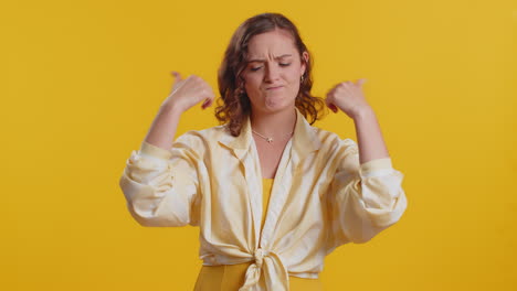 upset attractive young woman girl showing thumbs down sign gesture disapproval dissatisfied dislike