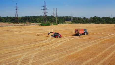 Tractors Harvesting Hay in a Field