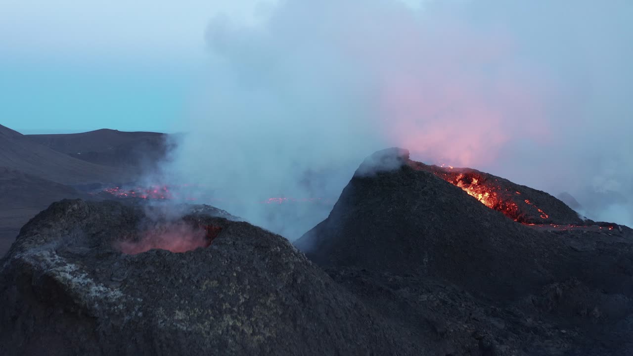 Active volcano mounds spewing magma and toxic gases from earths core