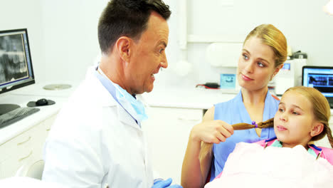 dentist interacting with young patient