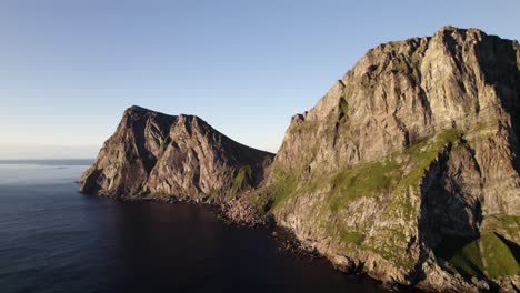 aerial shot of magnificent green mountains at kvalvika beach, norway