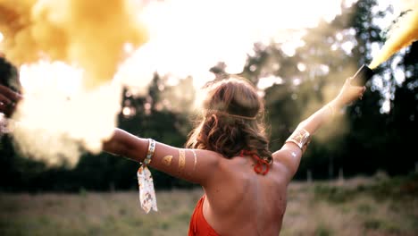 boho girl walking in nature with smoke flares