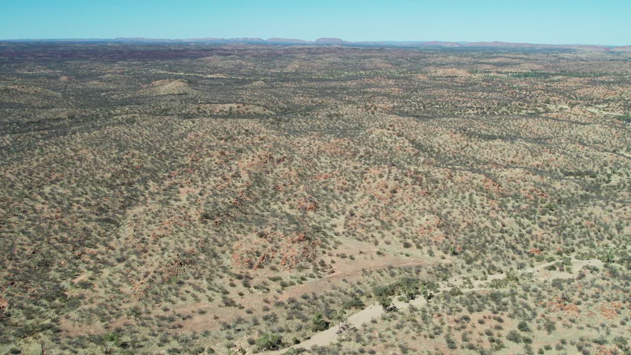 Aerial view of the dry landscape in Irlpme, a northern suburb of Alice Springs, Mparntwe, Northern Territory, Australia. August 2022.