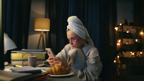 Boring-girl-reading-smartphone-at-home-closeup.-Serious-woman-watching-mobile