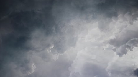 POV-lightning-flashes-among-thick-dark-clouds