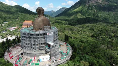 Hong-Kong-Nong-Ping-big-Buddha-and-surrounding-lush-green-environment,-Aerial-view