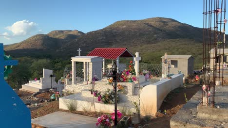 flowers on a grave in the pantheon municipal cemetary mexico