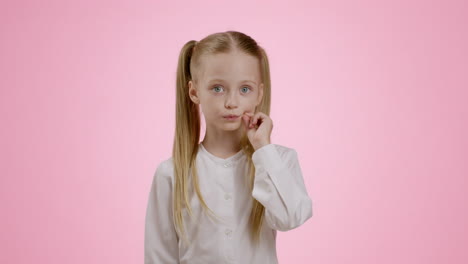 girl thinking on pink background