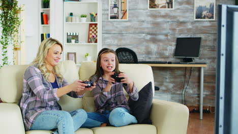 mother and daughter playing video games