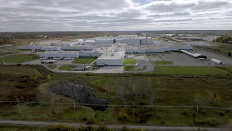 general motors auto plant in delta township, michigan with drone video pulling back