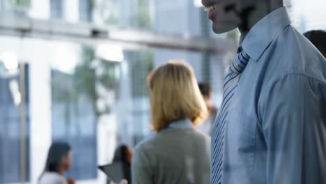 businessman text messaging on mobile phone