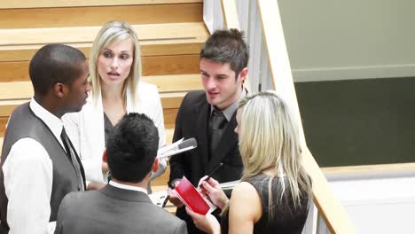 panorama of business team talking in corridor about work