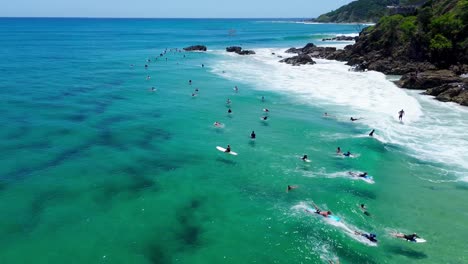 surfing at the the pass beach in byron bay australia