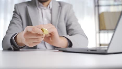 Financial-investment-businessman-looking-at-bitcoin-and-spinning-it.