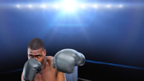 Animation-of-african-american-boxer-on-boxing-ring-over-spotlights