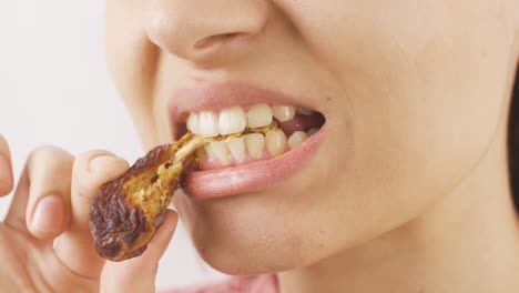 woman eating fresh dates in close-up. dry fruits.