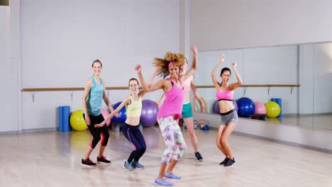 group of female friends jumping