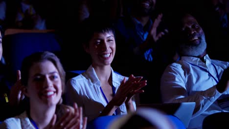 Business-people-applauding-in-business-seminar-at-auditorium-4k