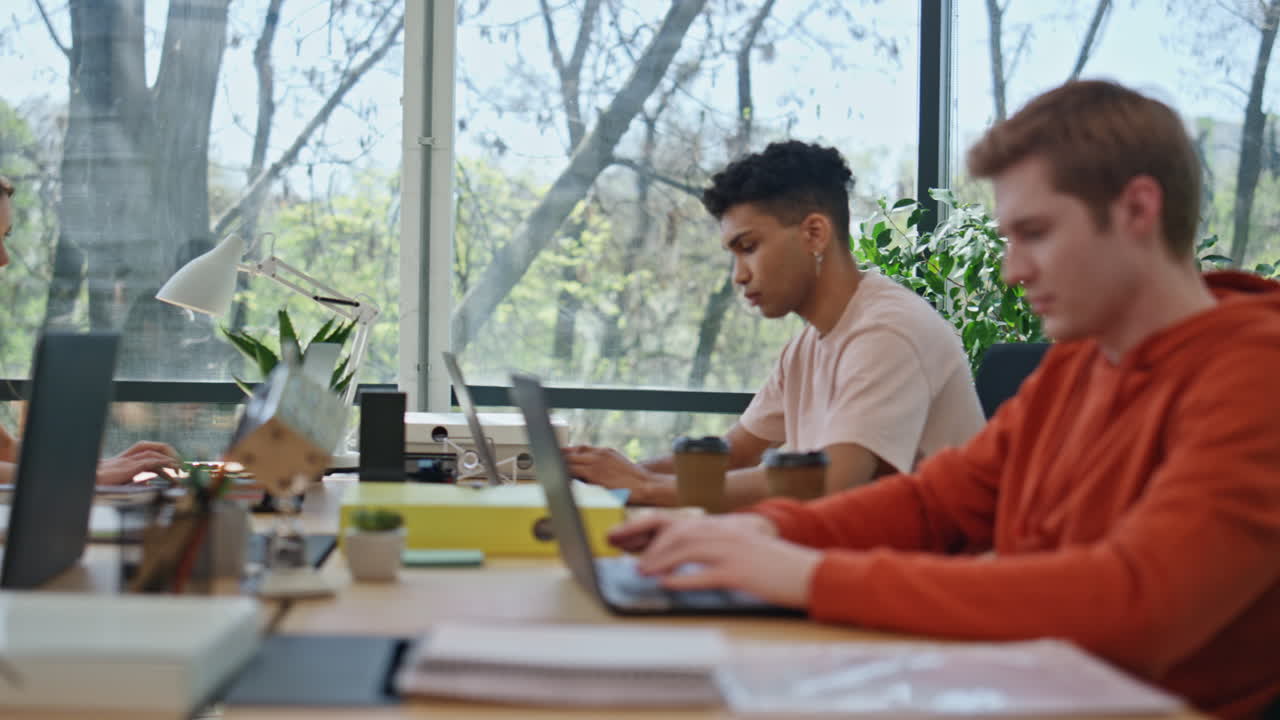 Diverse people working laptop open space closeup. Programmers team collaborating