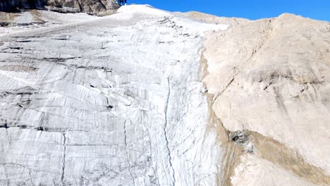 aerial views of the glacier in the north face of the marmolada mountain in the italian dolomites