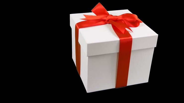 White gift box with red ribbon bow rotate at transparent background. Alpha channel chroma key transparent background. Have empty space for text. Fly above gift box.