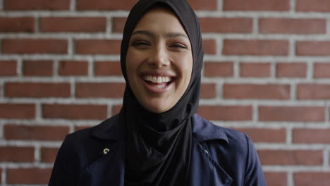 portrait happy young muslim woman laughing enjoying successful independent lifestyle mixed race female wearing hijab headscarf slow motion