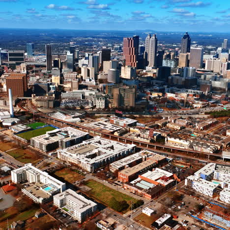 breath-taking view of atlanta panorama from aerial perspective. light blue sky with many white clouds above. top view.