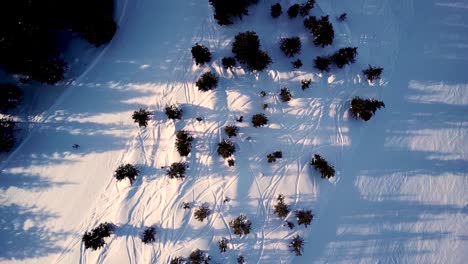 Aerial-view-of-the-ski-lift-at-the-foot-of-the-ski-slope-with-a-crowd-of-skiers-and-snowboarders